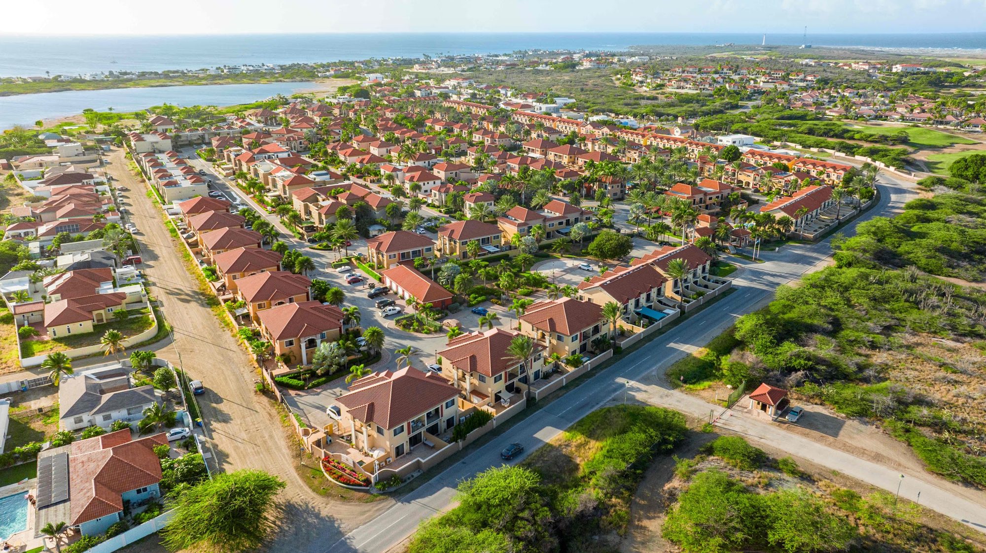 Drone view over the Gold Coast gated community, with the sea behind