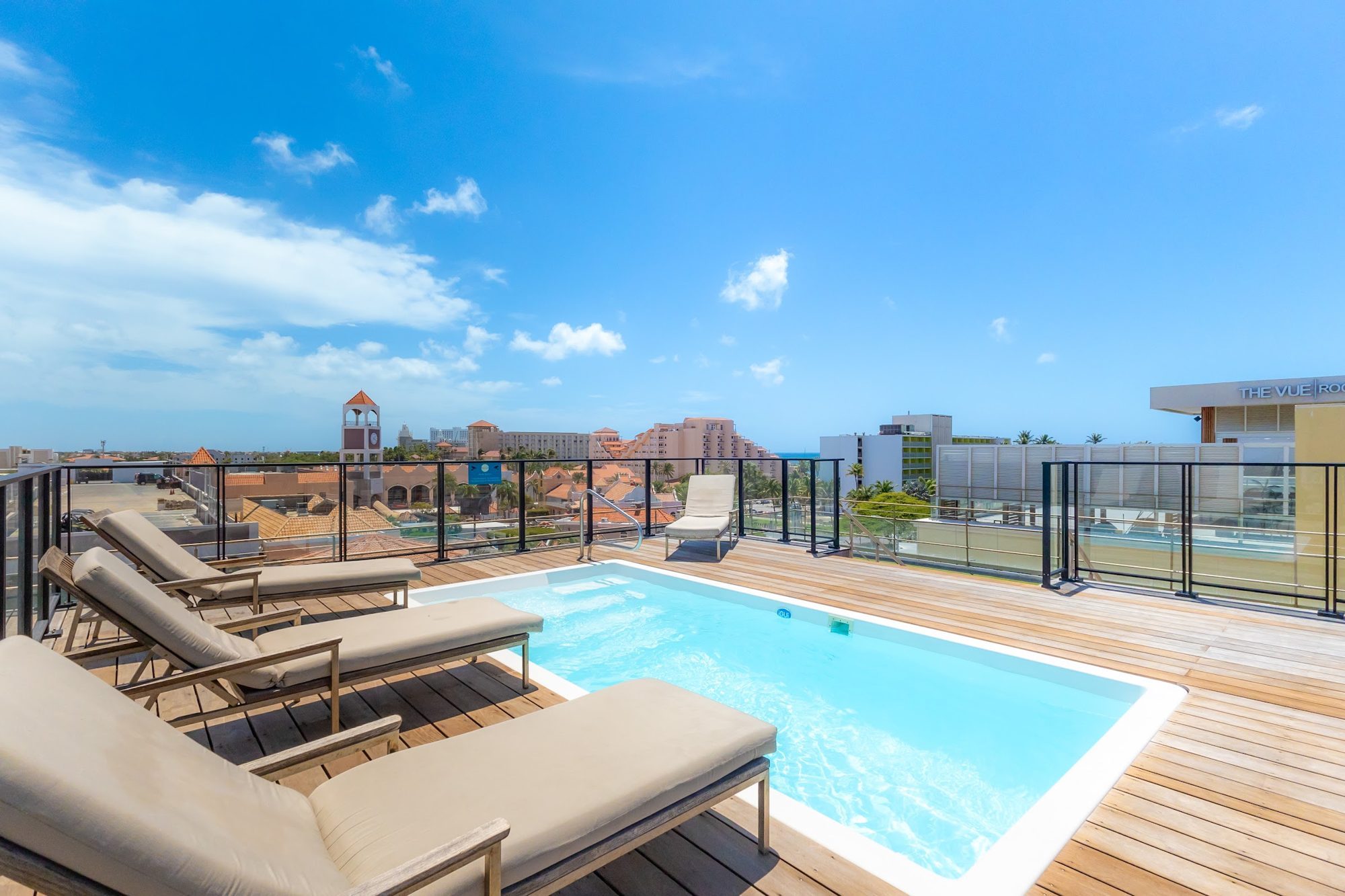 Rooftop pool with sun loungers over Palm Beach